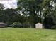 Spacious backyard with a storage shed, perfect for outdoor activities at 2410 Armstrong Park Dr, Gastonia, NC 28054