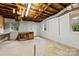 Bright unfinished basement with exposed ceiling, and exterior door at 2410 Armstrong Park Dr, Gastonia, NC 28054