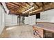 Unfinished basement space with exposed ceiling and utility connections, ample storage at 2410 Armstrong Park Dr, Gastonia, NC 28054