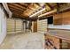 Spacious unfinished basement with built-in shelving and exposed ceiling at 2410 Armstrong Park Dr, Gastonia, NC 28054