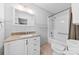 Well-lit bathroom with shower/tub combo, single sink vanity, and tiled floors at 2410 Armstrong Park Dr, Gastonia, NC 28054