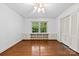 Bedroom featuring hardwood floors, built-in shelving, and a ceiling fan at 2410 Armstrong Park Dr, Gastonia, NC 28054