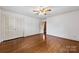 Bedroom featuring hardwood floors, closet space, and a ceiling fan at 2410 Armstrong Park Dr, Gastonia, NC 28054