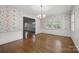 Large dining room with hardwood floors, wallpaper and ample natural light at 2410 Armstrong Park Dr, Gastonia, NC 28054