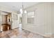 Bright dining area with bead board and a chandelier at 2410 Armstrong Park Dr, Gastonia, NC 28054