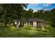 Charming brick home with mature trees and landscaping at 2410 Armstrong Park Dr, Gastonia, NC 28054