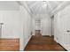 Bright hallway featuring hardwood floors, fresh white paint and views into another room at 2410 Armstrong Park Dr, Gastonia, NC 28054