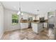 A bright eat-in kitchen features an island and stainless steel appliances at 2410 Armstrong Park Dr, Gastonia, NC 28054