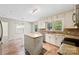 Bright kitchen with white cabinetry, granite countertops, and center island at 2410 Armstrong Park Dr, Gastonia, NC 28054