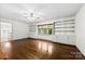 Spacious living room with hardwood floors, built-in bookshelves, and natural light at 2410 Armstrong Park Dr, Gastonia, NC 28054