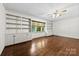 Spacious living room with hardwood floors, built-in bookshelves, and natural light at 2410 Armstrong Park Dr, Gastonia, NC 28054