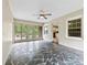 Bright sunroom with flagstone flooring and multiple windows offering natural light at 2410 Armstrong Park Dr, Gastonia, NC 28054