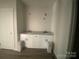 Bathroom vanity boasts granite countertops, white cabinetry, and modern fixtures at 28770 Hwy 73 Hwy, Albemarle, NC 28001