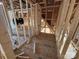 Interior framing showing wood stud construction, ceiling supports, and layout in this home under construction at 28770 Hwy 73 Hwy, Albemarle, NC 28001