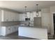 New kitchen features white cabinetry, granite countertops, subway tile backsplash and stainless appliances at 28770 Hwy 73 Hwy, Albemarle, NC 28001