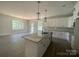 New kitchen features white cabinetry, granite countertops, a large island and stainless appliances at 28770 Hwy 73 Hwy, Albemarle, NC 28001