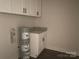 Functional laundry area with cabinets and granite countertop at 28770 Hwy 73 Hwy, Albemarle, NC 28001