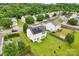 Home with solar panels surrounded by mature trees, showcasing the neighborhood's serene setting at 3038 Old Ironside Dr, Charlotte, NC 28213