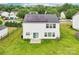 Aerial view shows a yard, complimented with solar panels on the home's roof at 3038 Old Ironside Dr, Charlotte, NC 28213