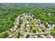 Aerial view of single-Gathering homes nestled in a well-maintained residential neighborhood with manicured lawns at 3038 Old Ironside Dr, Charlotte, NC 28213