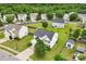 Aerial view showcasing home with well-manicured lawn, shed, and tree-lined neighborhood at 3038 Old Ironside Dr, Charlotte, NC 28213