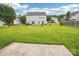 Expansive back yard, complemented by a concrete patio, perfect for outdoor activities and relaxation at 3038 Old Ironside Dr, Charlotte, NC 28213