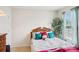 Bedroom with large window with curtains and a bed with decorative pillows at 3038 Old Ironside Dr, Charlotte, NC 28213