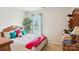 Charming bedroom with a bed, tree, and dresser offers a peaceful retreat with ample natural light at 3038 Old Ironside Dr, Charlotte, NC 28213