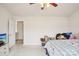 Bedroom showing a bed, open closet door, ceiling fan, and television at 3038 Old Ironside Dr, Charlotte, NC 28213