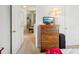 Bright bedroom with a five drawer dresser, a lamp, and a glimpse into the hall shows a comfortable space at 3038 Old Ironside Dr, Charlotte, NC 28213