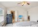 Bedroom with a ceiling fan, treadmill, and an open door to the walk-in closet at 3038 Old Ironside Dr, Charlotte, NC 28213