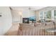 Comfortable living room with a fireplace, a ceiling fan and a large sectional sofa at 3038 Old Ironside Dr, Charlotte, NC 28213