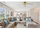 Open-concept living room with a comfortable sectional sofa and view into the adjacent kitchen area at 3038 Old Ironside Dr, Charlotte, NC 28213