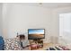 Bright living room with a TV, small table, and doorway, offers a comfortable and functional living area at 3038 Old Ironside Dr, Charlotte, NC 28213