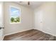 Well-lit bedroom with hardwood floors, fresh paint, and a large window that offer ample natural light at 3050 Millstone Dr, Gastonia, NC 28054