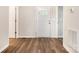 Inviting entryway with wood-look flooring and a white front door with glass panels at 3050 Millstone Dr, Gastonia, NC 28054