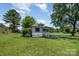 Beautiful one-story home with a lush yard and mature trees at 3050 Millstone Dr, Gastonia, NC 28054