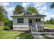 Cozy home with a covered front porch, ideal for enjoying the peaceful surroundings at 3050 Millstone Dr, Gastonia, NC 28054