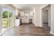 Modern kitchen with stainless steel appliances, white cabinetry, and subway tile backsplash at 3050 Millstone Dr, Gastonia, NC 28054