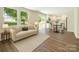 Inviting living room with stylish furnishings seamlessly connected to a modern, well-lit kitchen at 3050 Millstone Dr, Gastonia, NC 28054