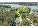 Beautiful aerial view of a wooded property showcasing the house, driveway, and natural surroundings at 317 Marietta Rd, Mooresville, NC 28117
