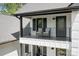 Stylish balcony with black railings and comfortable seating overlooking the neighborhood at 317 Marietta Rd, Mooresville, NC 28117