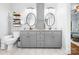 Elegant bathroom featuring a double vanity with granite countertops and decorative mirrors at 317 Marietta Rd, Mooresville, NC 28117