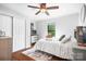Comfortable bedroom with a ceiling fan, a bed with a patterned cover, and a window at 317 Marietta Rd, Mooresville, NC 28117