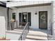 Cozy front porch with seating area and decorative wreath on the front door, creating a welcoming entrance at 317 Marietta Rd, Mooresville, NC 28117
