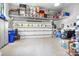 Well-organized garage with epoxy flooring, overhead storage shelves, and ample space for vehicles and equipment at 317 Marietta Rd, Mooresville, NC 28117