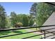 Scenic view of a lush green lawn and mature trees from a house balcony at 317 Marietta Rd, Mooresville, NC 28117