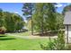 Picturesque view of a well-manicured lawn and a lake from an elevated vantage point at 317 Marietta Rd, Mooresville, NC 28117