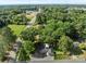 A high angle shows a beautiful home nestled among mature trees in a serene setting at 319 N Central Ave, Locust, NC 28097