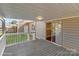 A covered back porch is perfect for enjoying the backyard or relaxing in the shade at 319 N Central Ave, Locust, NC 28097